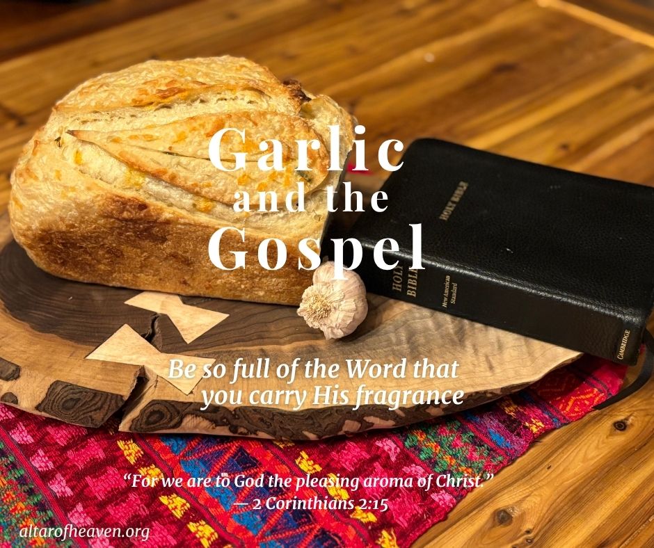 Photo of a loaf of bread, garlic cloves, and a Bible on a wooden table illustrating the devotional theme “Garlic and the Gospel: Becoming the Fragrance of Christ.”